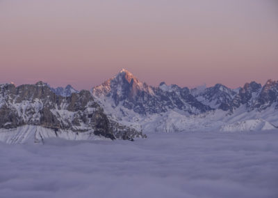 Sunset on the Aiguille Verte with a sea of clouds over the valley of Sallanches. Aravis, France